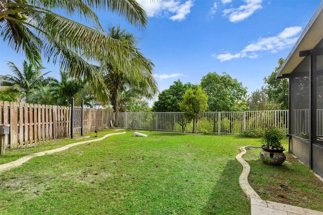 view of yard with a sunroom