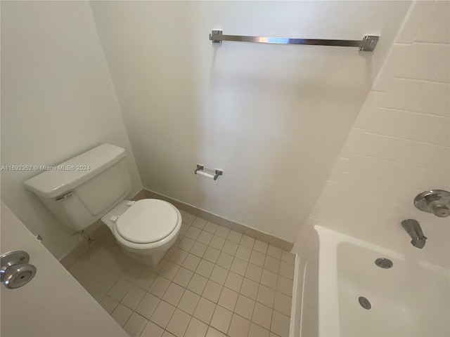 bathroom featuring toilet and tile patterned flooring