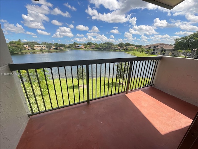 balcony featuring a water view