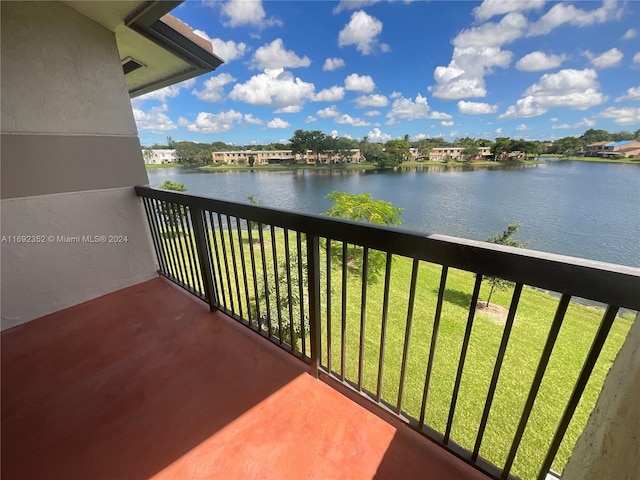 balcony featuring a water view