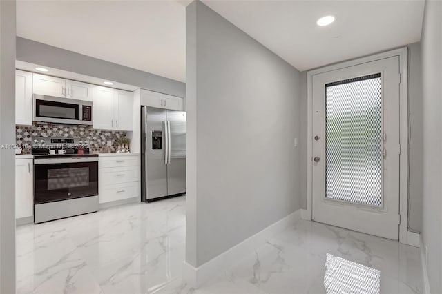 doorway with recessed lighting, marble finish floor, and baseboards