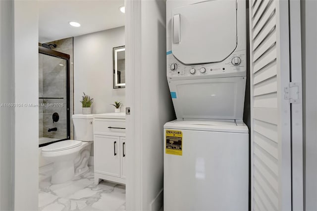 washroom with stacked washer and dryer