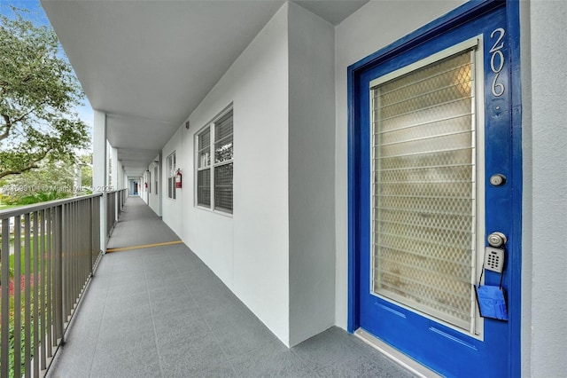 property entrance featuring stucco siding