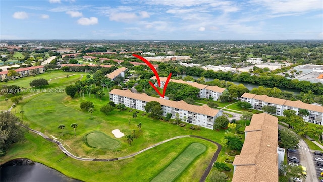 aerial view with view of golf course and a water view
