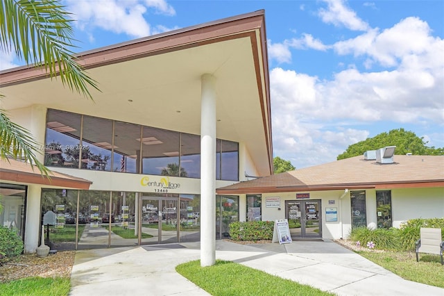 view of building exterior featuring concrete driveway