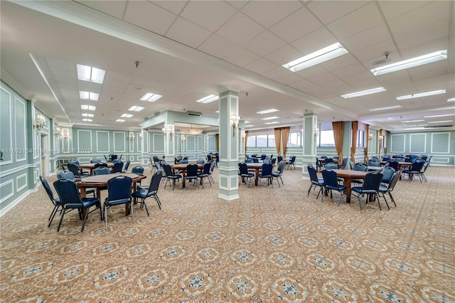 dining room with a drop ceiling