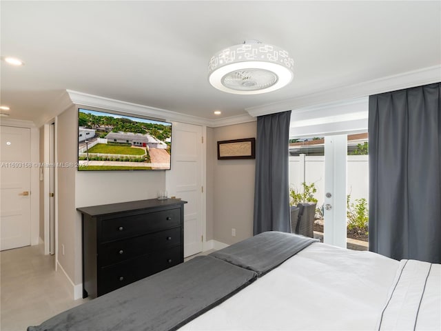 bedroom with access to outside, multiple windows, and ornamental molding