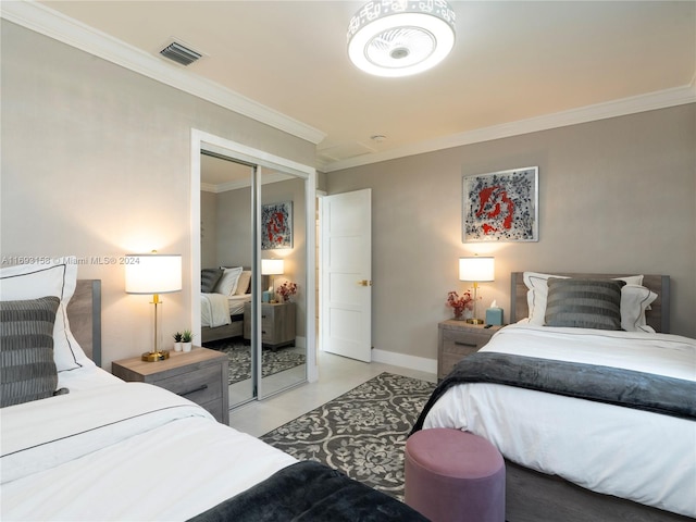 bedroom with a closet and crown molding