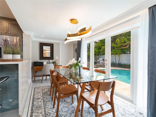 dining space featuring ornamental molding