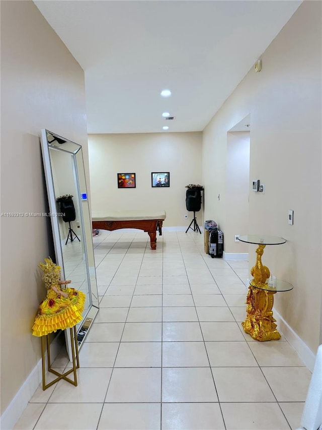 interior space with light tile patterned floors and billiards