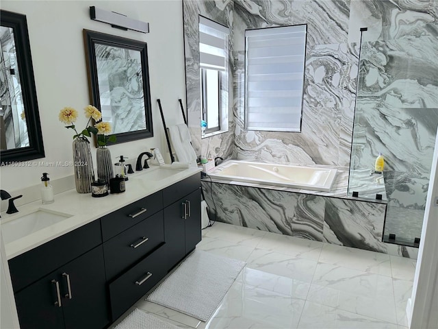 bathroom with tiled bath and vanity