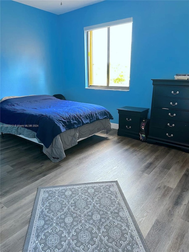 bedroom featuring wood-type flooring