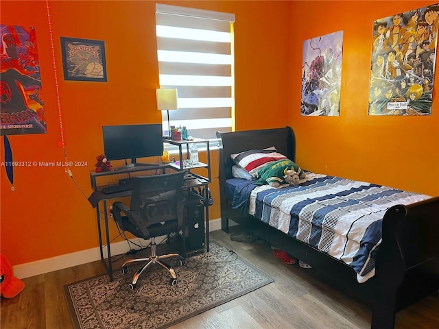 bedroom featuring hardwood / wood-style floors