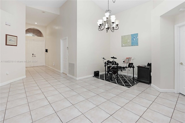 dining area featuring high vaulted ceiling, an inviting chandelier, and light tile patterned floors