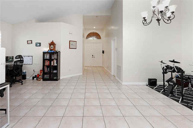 foyer with a notable chandelier and light tile patterned flooring