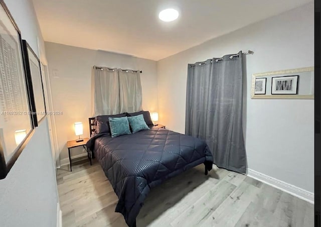 bedroom with light hardwood / wood-style floors