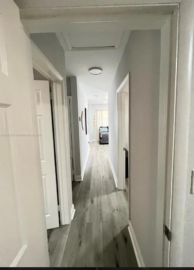 corridor featuring hardwood / wood-style flooring