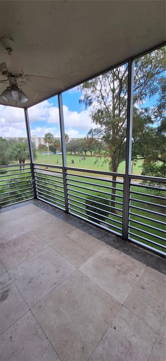 view of patio / terrace featuring ceiling fan and a balcony