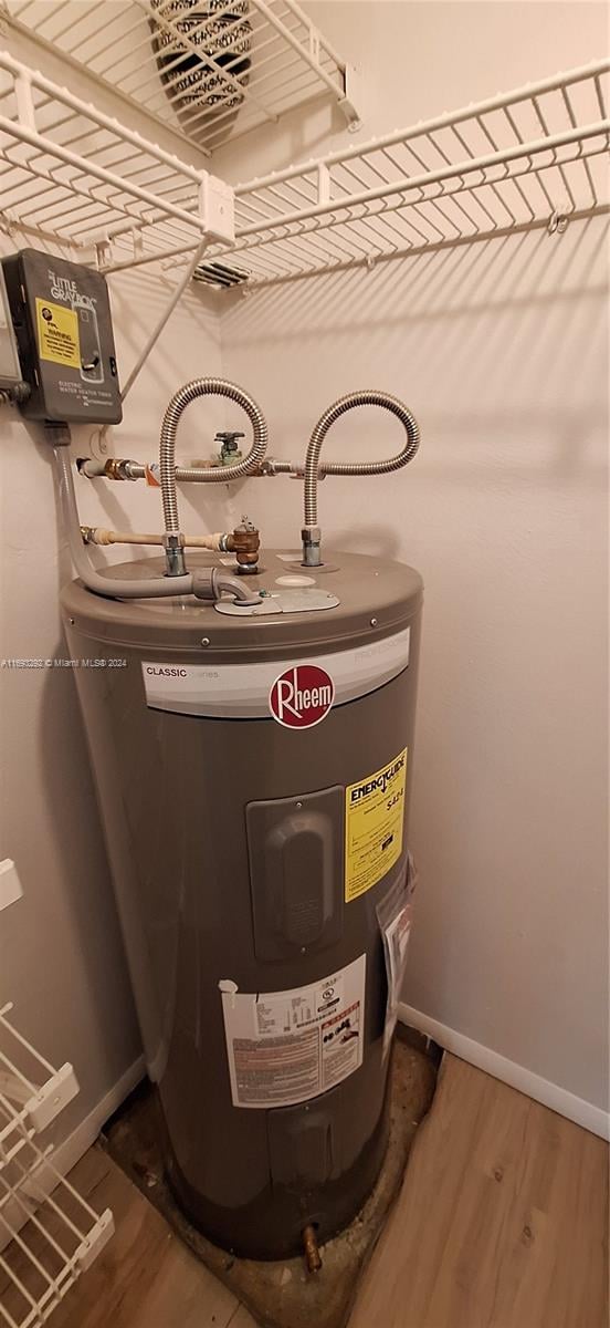 utility room featuring electric water heater