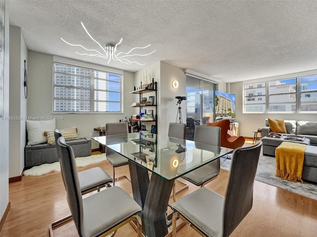 1833 S Ocean Dr Unit 1702, Hallandale Beach, FL 33009 - dining space featuring wood finished floors, a textured ceiling, and baseboards