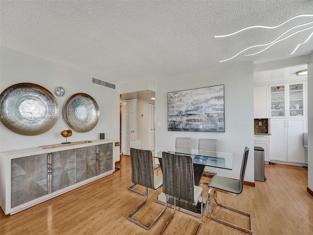1833 S Ocean Dr Unit 1702, Hallandale Beach, FL 33009 - dining space with wood finished floors and a textured ceiling
