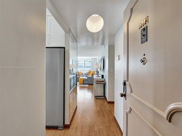 hallway with light wood-type flooring