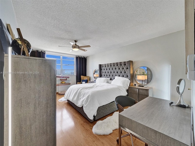 1833 S Ocean Dr Unit 1702, Hallandale Beach, FL 33009 - bedroom featuring wood finished floors, a textured ceiling, and a ceiling fan