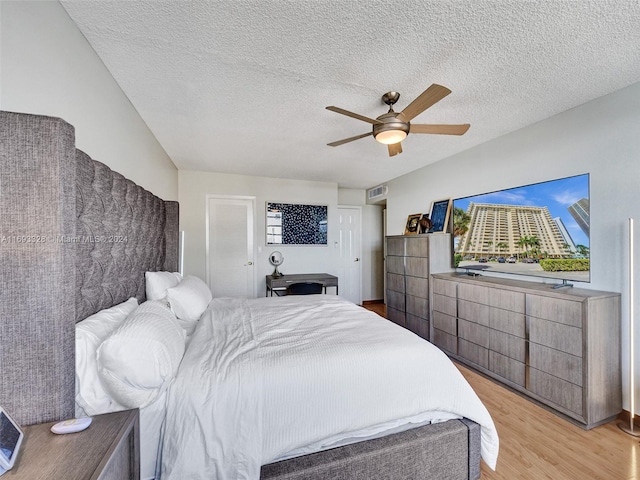 1833 S Ocean Dr Unit 1702, Hallandale Beach, FL 33009 - bedroom featuring light wood-style floors, ceiling fan, and a textured ceiling