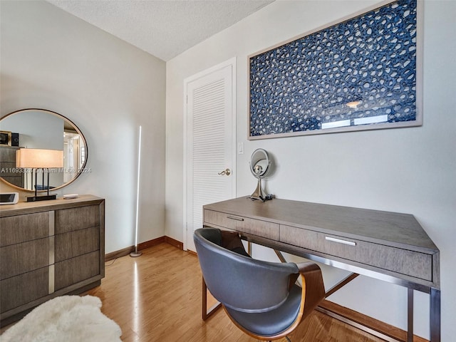 1833 S Ocean Dr Unit 1702, Hallandale Beach, FL 33009 - office area with wood finished floors, baseboards, and a textured ceiling