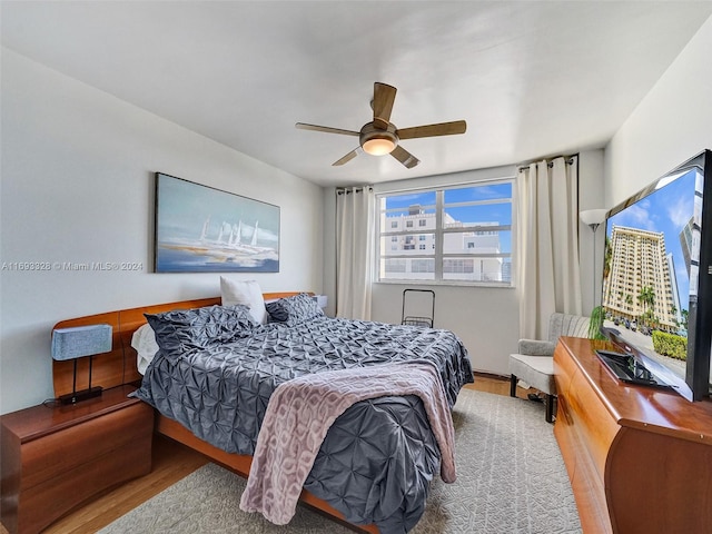 bedroom featuring ceiling fan and wood-type flooring