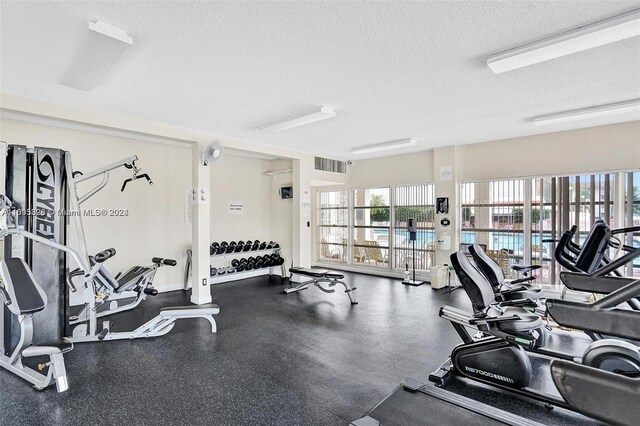 1833 S Ocean Dr Unit 1702, Hallandale Beach, FL 33009 - gym featuring a textured ceiling