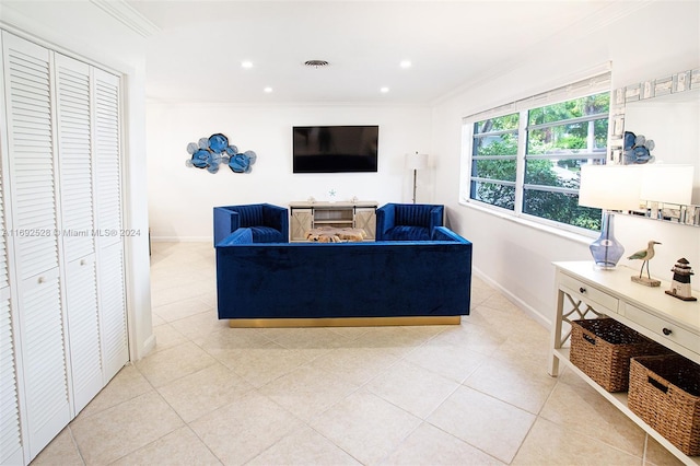 tiled living room with ornamental molding