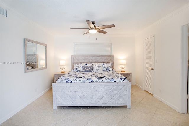 bedroom featuring a closet, light tile patterned flooring, ceiling fan, and crown molding