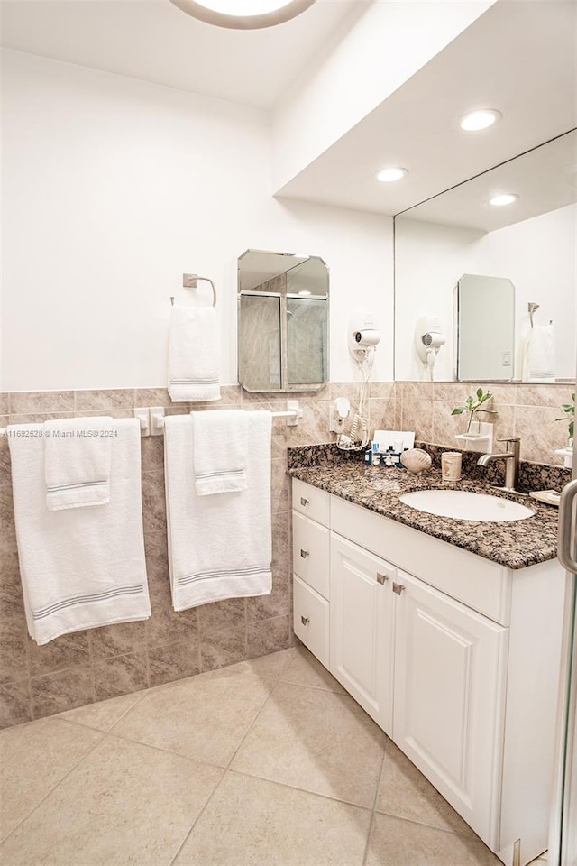 bathroom featuring tile walls, vanity, and tile patterned floors