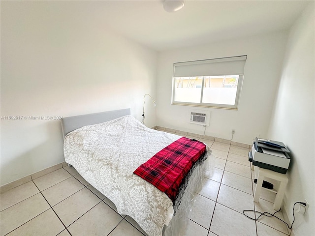 tiled bedroom featuring an AC wall unit