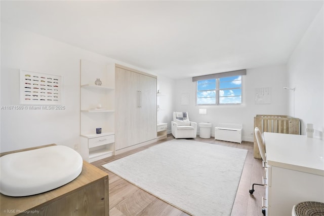 bedroom featuring light wood finished floors