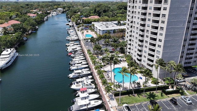 90 Edgewater Dr Unit 1015, Coral Gables, FL 33133 - bird's eye view of a pool area, a nearby body of water, and apartment complex / building