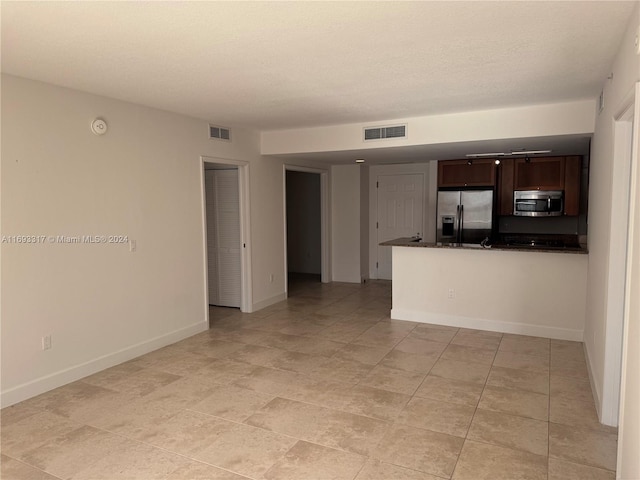 spare room with light tile patterned flooring