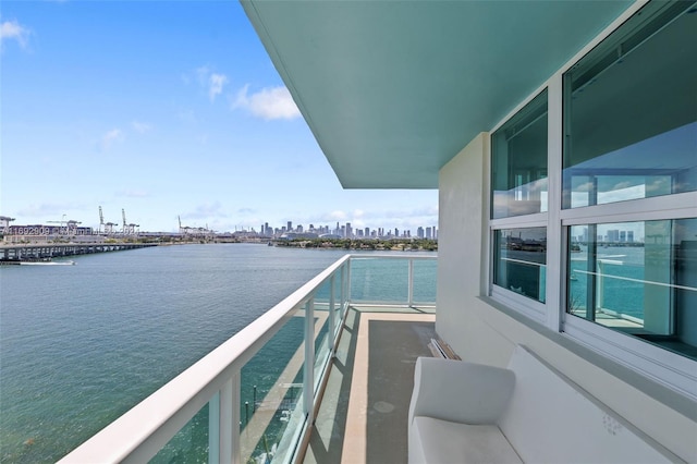 balcony featuring a water view