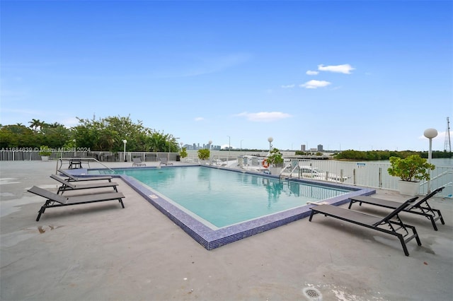 view of swimming pool featuring a patio