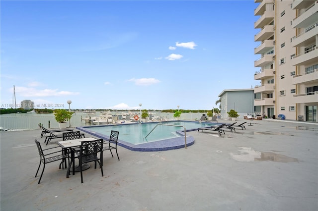 view of swimming pool with a patio