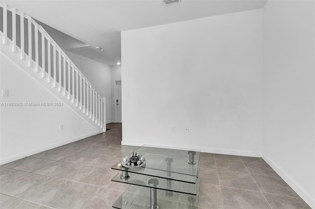 spare room with tile patterned floors