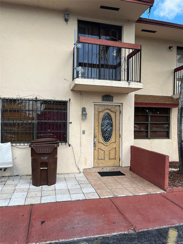 doorway to property with a balcony