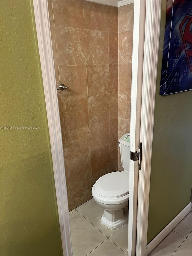 bathroom featuring toilet and tile patterned flooring