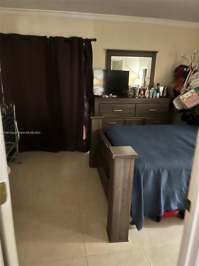 tiled bedroom with crown molding