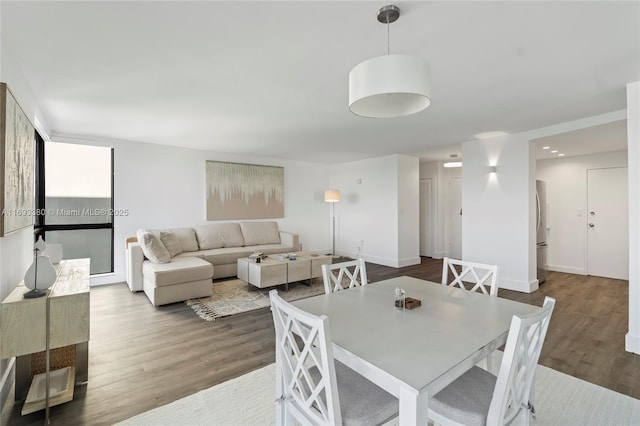 dining space featuring hardwood / wood-style flooring