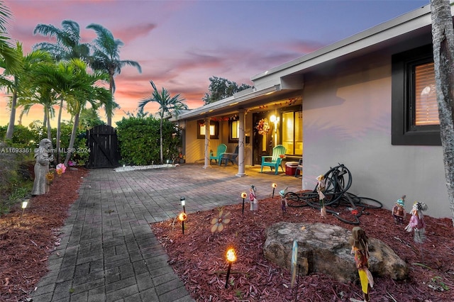 view of patio terrace at dusk