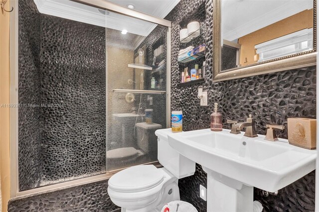 bathroom with decorative backsplash, ornamental molding, an enclosed shower, and toilet