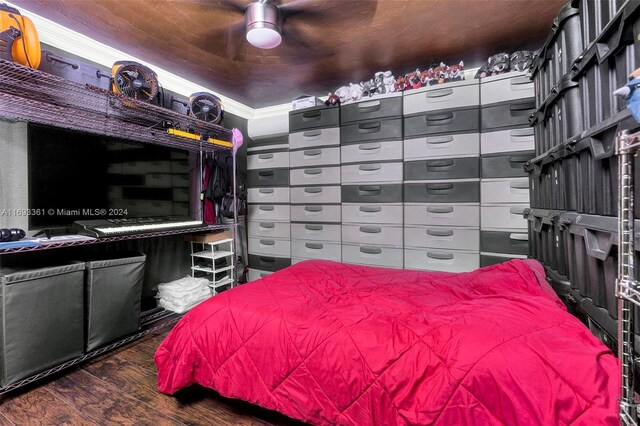 bedroom with ceiling fan and dark wood-type flooring