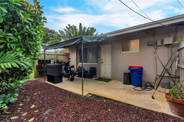 back of property with a patio area